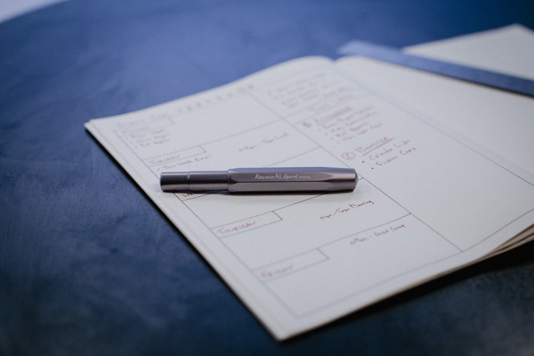 a pen sitting on top of a piece of paper